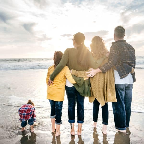 future a family standing on the beach